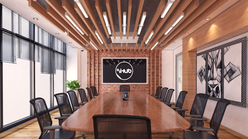 Chairs and a wooden table in an iHub working space