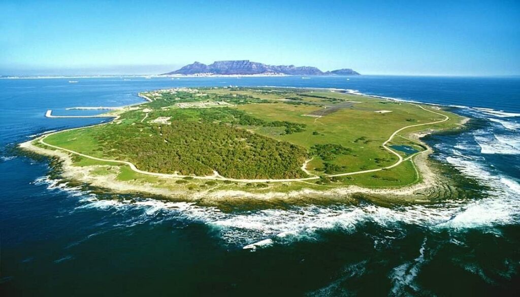 A piece of land surrounded by a body of water