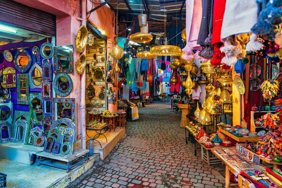 The colorful shops full with items in the city of Medina in Marrakech